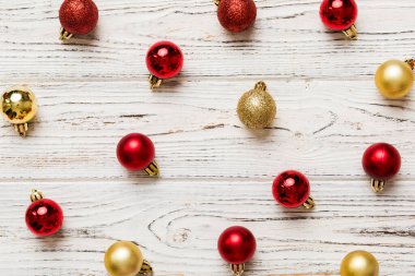 Christmas composition. a pattern of christmas balls on colored background. Flat lay, top view New year decor.