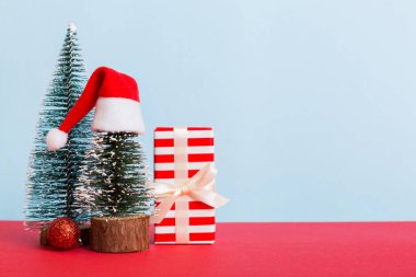 Christmas composition. craft Gift box, small tree, branches and craft DIY decorations on white background. New year concept. Christmas home decoration Flat lay, top view, copy space.