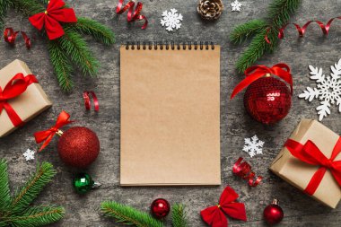 Christmas blank greeting card mock-up scene. Creative layout made of Christmas tree branches and paper card note. Flat lay. Nature New Year concept.