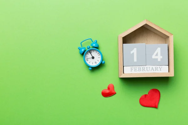 Valentine Day theme with wooden block calendar. Greeting card template for Valentines Day. Top view, copy space for text.