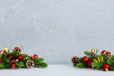 New Year Christmas tree toy, branches of a christmas tree, New Year decorations on a colored background.