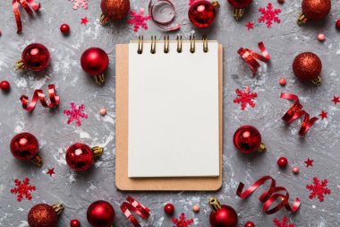 Christmas blank greeting card mock-up scene. Creative layout made of Christmas tree branches and paper card note. Flat lay. Nature New Year concept.