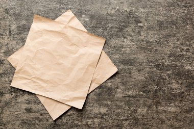 top view with baking parchment empty on table background. Folded cloth for mockup with copy space, Flat lay. Minimal style.
