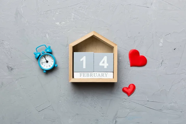 Valentine Day theme with wooden block calendar. Greeting card template for Valentines Day. Top view, copy space for text.