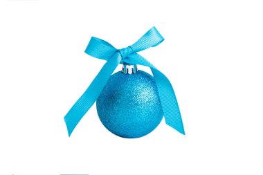 Christmas ball on colored background. decoration bauble with ribbon bow with copy space.