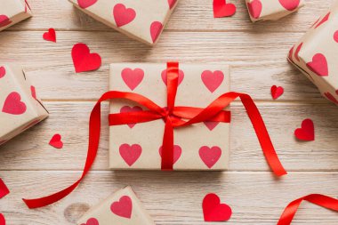 Creative gift box with decorations for the holiday, top view. Birthday and valentine present.