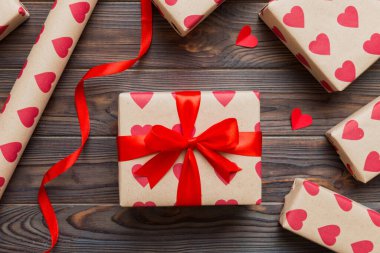 Creative gift box with decorations for the holiday, top view. Birthday and valentine present.