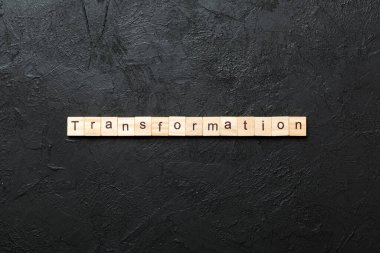 transformation word written on wood block. transformation text on table, concept. clipart