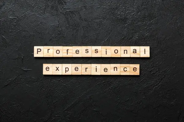 professional experience word written on wood block. professional experience text on cement table for your desing, concept.