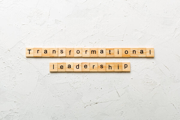transformation leadership word written on wood block. transformation leadership text on cement table for your desing, concept.