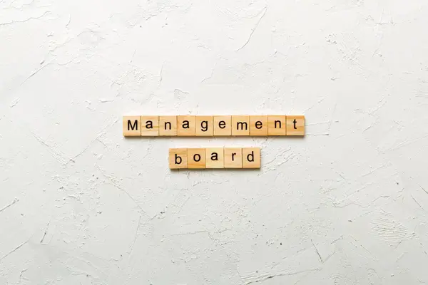 stock image Management board word written on wood block. Management board text on cement table for your desing, concept.