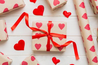 Creative gift box with decorations for the holiday, top view. Birthday and valentine present.