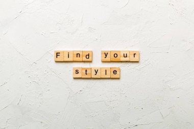 find your style word written on wood block. find your style text on table, concept. clipart