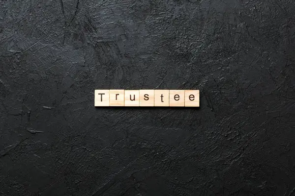 stock image trustee word written on wood block. trustee text on table, concept.