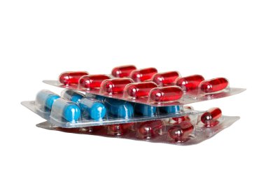 too many different pill cartridges stacked. selective Focus. Packs of blister pills with tablets. Colored pastilles packages. A pile of medicine in blister packs. Pharmaceutical blister packs.