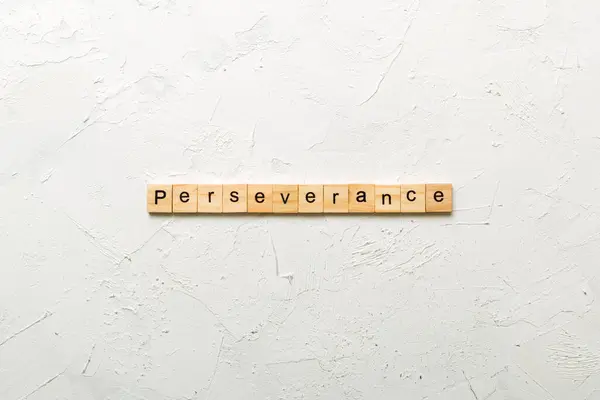 stock image perseverance word written on wood block. perseverance text on table, concept.