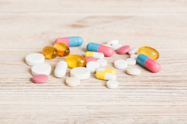 Collection Of Various Medical Tablets And Pills. Assorted pharmaceutical medicine pills, tablets and capsules on table background. Heap of assorted various medicine tablets. Health care.