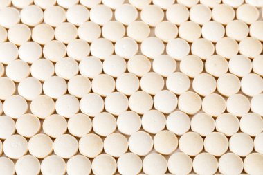 Many colorful pills top viev. Set of many pills on colored background.