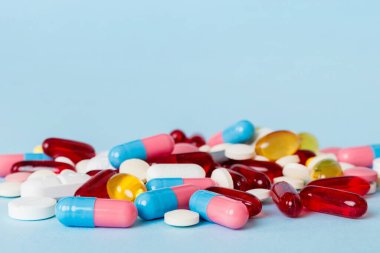 Many different colorful medication and pills perspective view. Set of many pills on colored background.