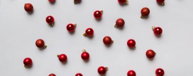 Christmas composition. a pattern of christmas balls on colored background. Flat lay, top view New year decor.