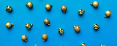 Christmas composition. a pattern of christmas balls on colored background. Flat lay, top view New year decor.