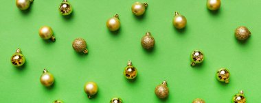 Christmas composition. a pattern of christmas balls on colored background. Flat lay, top view New year decor.