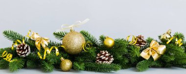 New Year Christmas tree toy, branches of a christmas tree, New Year decorations on a colored background.