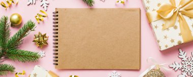 Christmas blank greeting card mock-up scene. Creative layout made of Christmas tree branches and paper card note. Flat lay. Nature New Year concept.