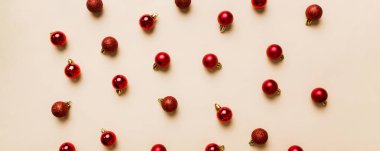 Christmas composition. a pattern of christmas balls on colored background. Flat lay, top view New year decor.
