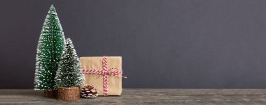 Christmas composition. Gifts, small tree, branches and craft DIY decorations on white background. New year concept. Christmas home decoration Flat lay, top view, copy space.