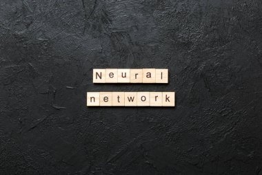 NEURAL NETWORK word written on wood block. NEURAL NETWORK text on cement table for your desing, concept. clipart