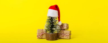 Christmas composition. Gifts, small tree, branches and craft DIY decorations on white background. New year concept. Christmas home decoration Flat lay, top view, copy space.