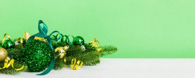 New Year Christmas tree toy, branches of a christmas tree, New Year decorations on a colored background.