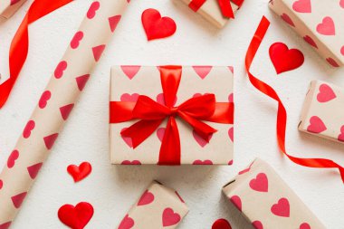 Creative gift box with decorations for the holiday, top view. Birthday and valentine present.