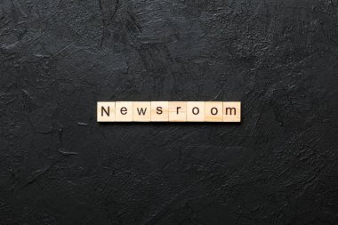 NEWSROOM word made with wooden blocks concept. clipart