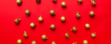 Christmas composition. a pattern of christmas balls on colored background. Flat lay, top view New year decor.