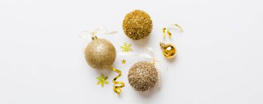 Christmas ball on colored background. decoration bauble with ribbon bow with copy space.