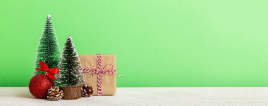 Christmas composition. Gifts, small tree, branches and craft DIY decorations on white background. New year concept. Christmas home decoration Flat lay, top view, copy space.