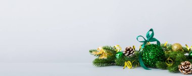 New Year Christmas tree toy, branches of a christmas tree, New Year decorations on a colored background.