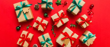 Colored craft gift boxes with colorful ribbons on colored background. Collection of Christmas present boxes .