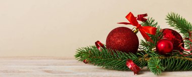 New Year Christmas tree toy, branches of a christmas tree, New Year decorations on a colored background.
