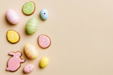 Happy Easter concept. Preparation for holiday. Easter eggs on colored background. flat lay top view copy space banner.