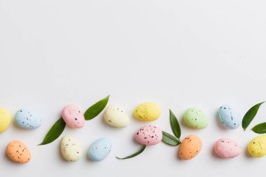 Happy Easter concept. Preparation for holiday. Easter eggs on colored background. flat lay top view copy space banner.