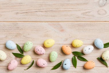 Happy Easter concept. Preparation for holiday. Easter eggs on colored background. flat lay top view copy space banner.