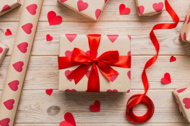 Creative gift box with decorations for the holiday, top view. Birthday and valentine present.