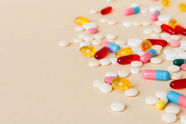 Many different colorful medication and pills perspective view. Set of many pills on colored background.
