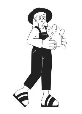 Bahçıvan kıdemli kadın elinde siyah-beyaz çizgi film karakteri tutuyor. Büyükanne bahçıvanlığı. Kadın çiftçi olgun, izole bir taşıyıcı. Bahçecilik tek renkli düz nokta çizimi