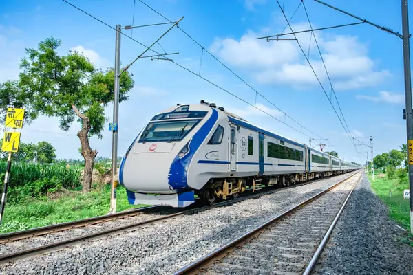 stock image Pune, India - June 23 2024: The Vande Bharat Express heading towards Mumbai during the monsoon season near Pune India. Monsoon is the annual rainy season in India from June to September.