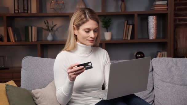 Happy Satisfied Woman Sitting Sofa Makes Online Shopping Using Credit — Stock Video