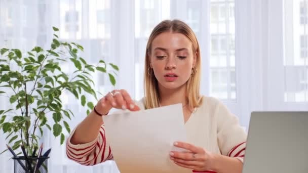Sad Worried Woman Sitting Table Reads Received Bad News Holds — Stock video